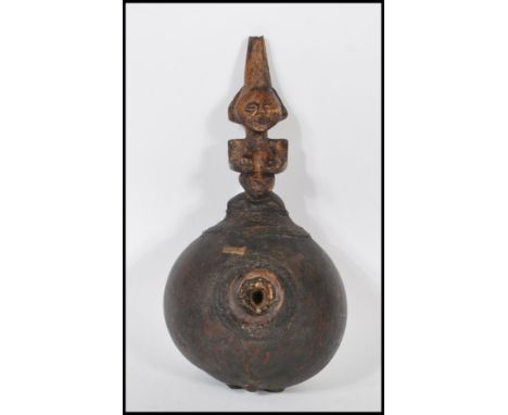 An early 20th century African Congalese Luba tribe - Tribal chiefs gourd pipe. Of bulbous form with carved fertility female w