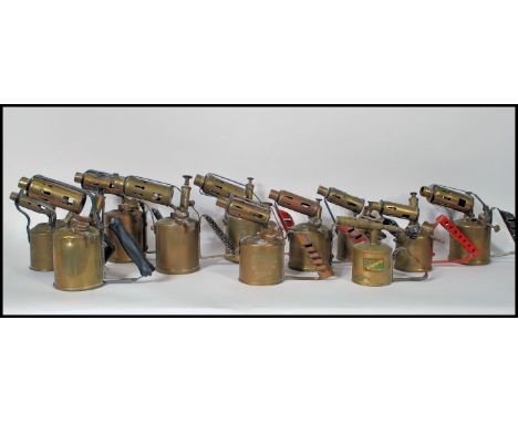 A collection of vintage 20th Century brass and copper blow torches to include many makes such as Primus etc