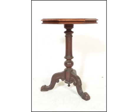 A 19th Century Victorian mahogany wine occasional table raised on carved tripod base.&nbsp;The octagonal table top raised on 