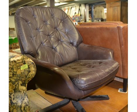 A vintage 1970's brown leather button back and seat leather armchair / swivel chair, having a five point base.&nbsp;&nbsp;
