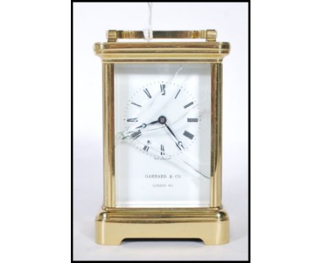 A late 20th Century striking carriage clock retailed by Garrard &amp; Co, the movement by Epee and having a rectangular white