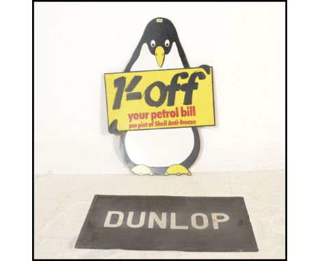 A vintage 20th century Shell advertising board in the form of a penguin with notation to centre. The wooden board with painte