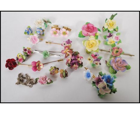 A collection of vintage 20th Century bone china flower jewellery and accessories to include a selection of brooches, hat pins
