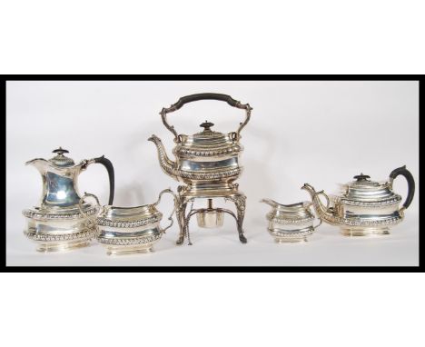 A very rare Edwardian silver hallmarked five / 5 piece coffee and tea service by Joseph Rogers comprising ot spirit kettle on