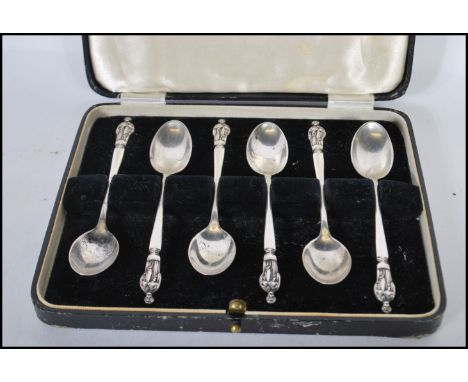 A set of six cased silver hallmarked Apostle teaspoons, the spoons with retailers mark for H &amp; R Marsh Bath, Birmingham a