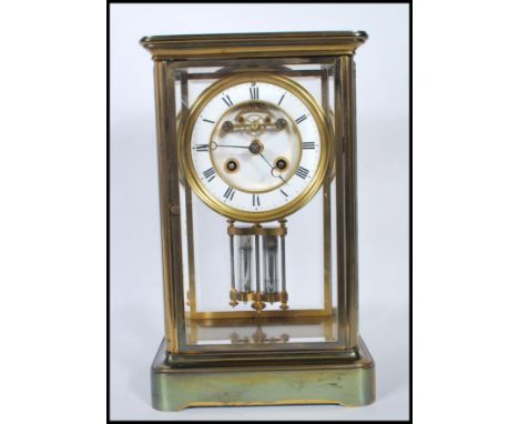 An early 20th Century Mappin &amp;&nbsp; Webb gilt brass bevelled glass panelled mantel clock having a white enamelled chapte