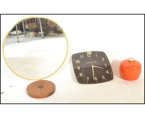 A collection of vintage retro 20th Century interiors items to include an adjustable table mirror being raised on a round teak