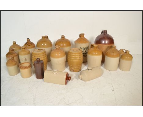 An extensive local collection of 19th century and early 20th century stoneware / saltglaze flagons being of South West intere