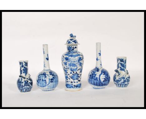 A group of 19th Century Japanese small blue and white ceramics to include a temple jar with a domed lid having a fu dog finia