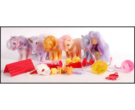 A collection of original vintage 1980's Hasbro made My Little Ponies comprising of five ponies and various accessories. Each 