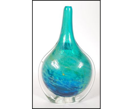 A vintage 20th century Mdina studio art glass stem vase having blue and yellow swirl design. Signed to the base.