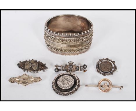 A collection of silver jewellery dating from the 19th Century onwards to include three silver hallmarked brooches including a