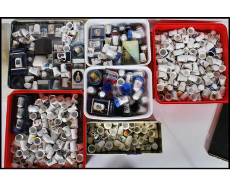 A very large collection of thimbles and thimble display stands, thimbles of various form to include ceramic and silver white 