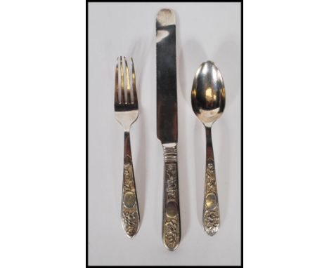 A Chinese silver singular cutlery set consisting on a knife, fork and spoon having floral decoration to handles. Marked WS to