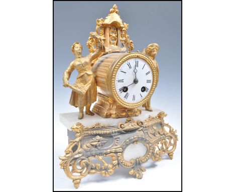 A 19th century French Ormolu mantel clock,in the manner of Martinot a Paris. The clock with a drum cased striking movement be