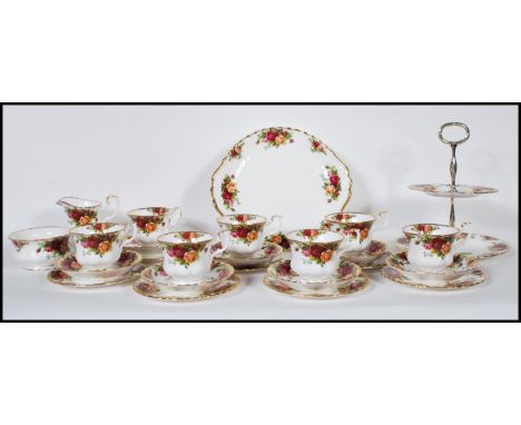 A Royal Albert Old Country Roses part tea set to include creamer jug, sugar bowl, cups, saucers, plate stand, plate, and thre