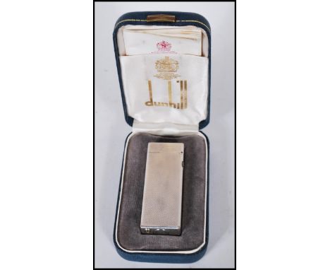 A vintage Dunhill tallboy rollagas lighter US Re24163, complete in original box with paperwork having diamond cut decoration.
