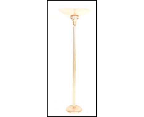 An Art Deco style standard lamp / uplighter having corinthian style column with demilune shade atop, raised on a circular bas