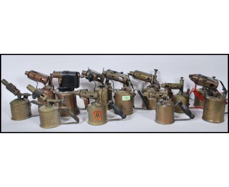A collection of vintage 20th Century brass and copper blow torches to include many makes such as Primus etc