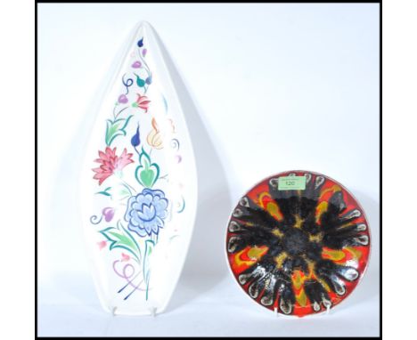 Two 20th Century Poole studio pottery cabinet plates, the spear plate decorated with flowers, stamped and signed to the verso