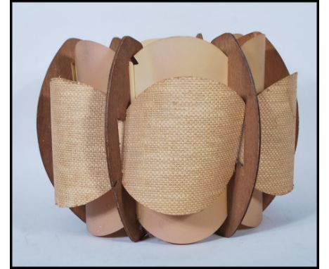 A 20th century retro vintage layered lamp light fixture shade having a hessian type fabric back with shaped teak wood panel b