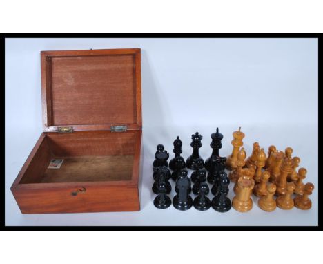 A 20th Century believed Staunton Chessmen boxwood and ebony&nbsp;Chess set by J. Jaques and Son Ltd of London. A black and wh