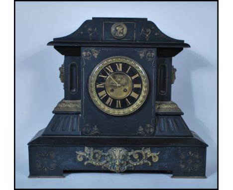 A 19th Century Victorian large and impressive slate marble mantel clock of architectural form by J Marti &amp; Co France. The