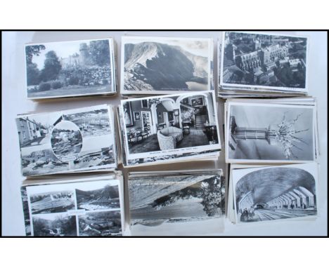 A large collection of vintage real photographic postcards. All B&amp;W standard (small) size British views.Approx 700 in box.