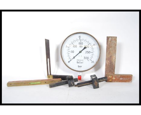 A vintage early 20th Century brass pressure gauge from the Courage brewery together with a selection of ebony and brass wood 