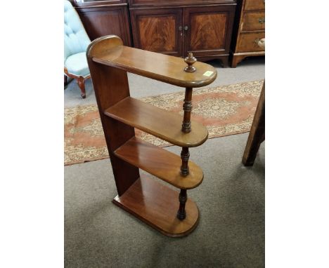 A 19th Century Victorian mahogany free standing 4 tier bar stand / shop display shelf rack, joined together by a flat one pie