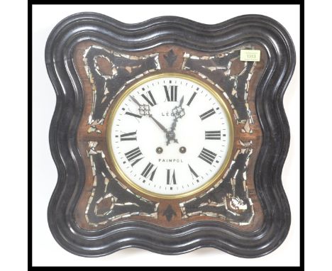 A French 19th century ebonised ' Leon Paimpol ' bullseye clock having enamel dial with mother of pearl insets and faceted han