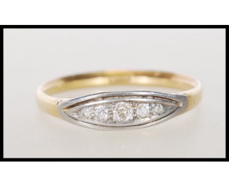 A stamped 18ct gold ring set with a row of round cut graduating diamonds to the head. Weight 2.5g. Size R.5.