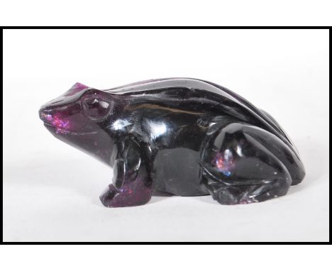 A 20th Century carved amethyst figurine in the form of a tropical frog.