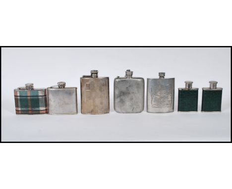 A collection of vintage 20th Century hip flask including a Jack Daniels whisky advertising flask, two engine turned flasks, t