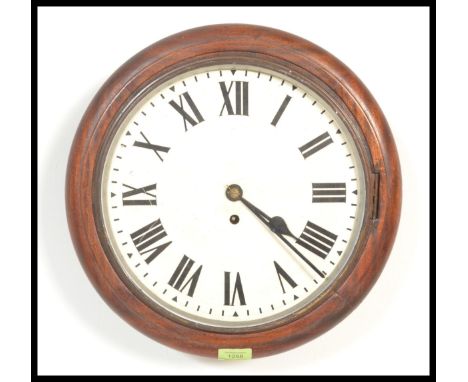 A 19th century Victorian mahogany station clock of circular form having a fusee brass movement. The clock back with trap door