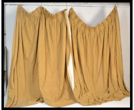 A pair of vintage Laura Ashley curtains of large proportions, having floral patterning with golden brown colour, both lined. 