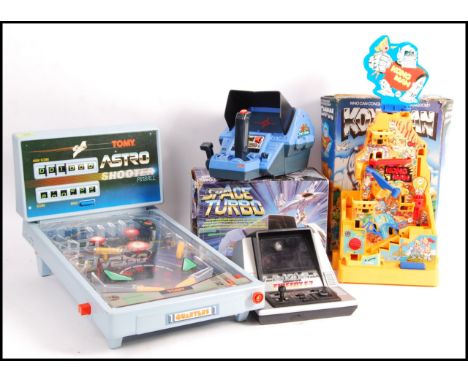 A collection of original vintage electronic toys and games comprising: Grandstand Firefox F-7 with battery cover, boxed Tomy 