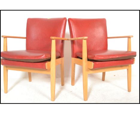 A set of four vintage retro Parker Knoll model 733 open framed armchairs, sweeping arms, seat pads and backrests upholstered 