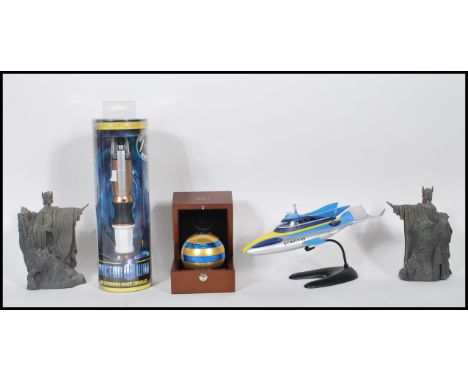 A small collection of items to include a cased Ball of Isis puzzle adventure game, a die cast model of Stingray on stand a a 