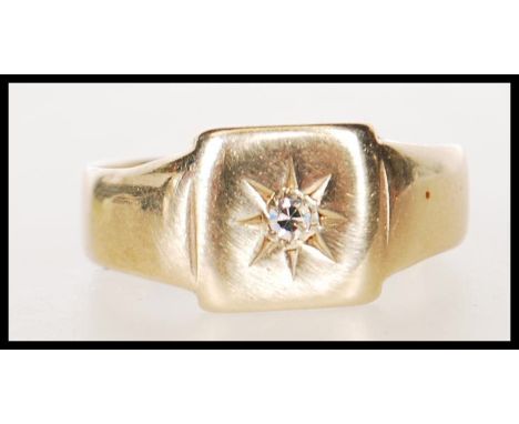 A hallmarked 9ct gold signet ring having a square head set with a brilliant cut diamond. Hallmarked Birmingham 1956. Weight 3