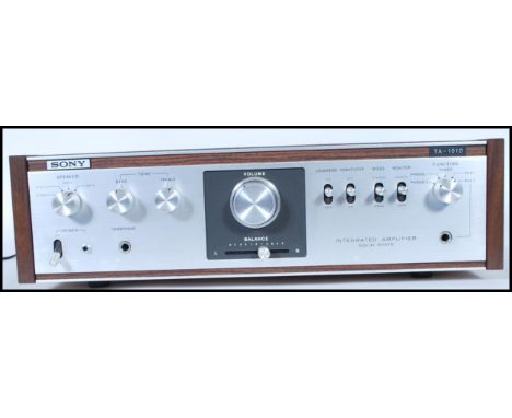 A vintage retro 20th Century teak wood cased Sony TA-1010 Stereo Integrated Amplifier, within original shipping box.