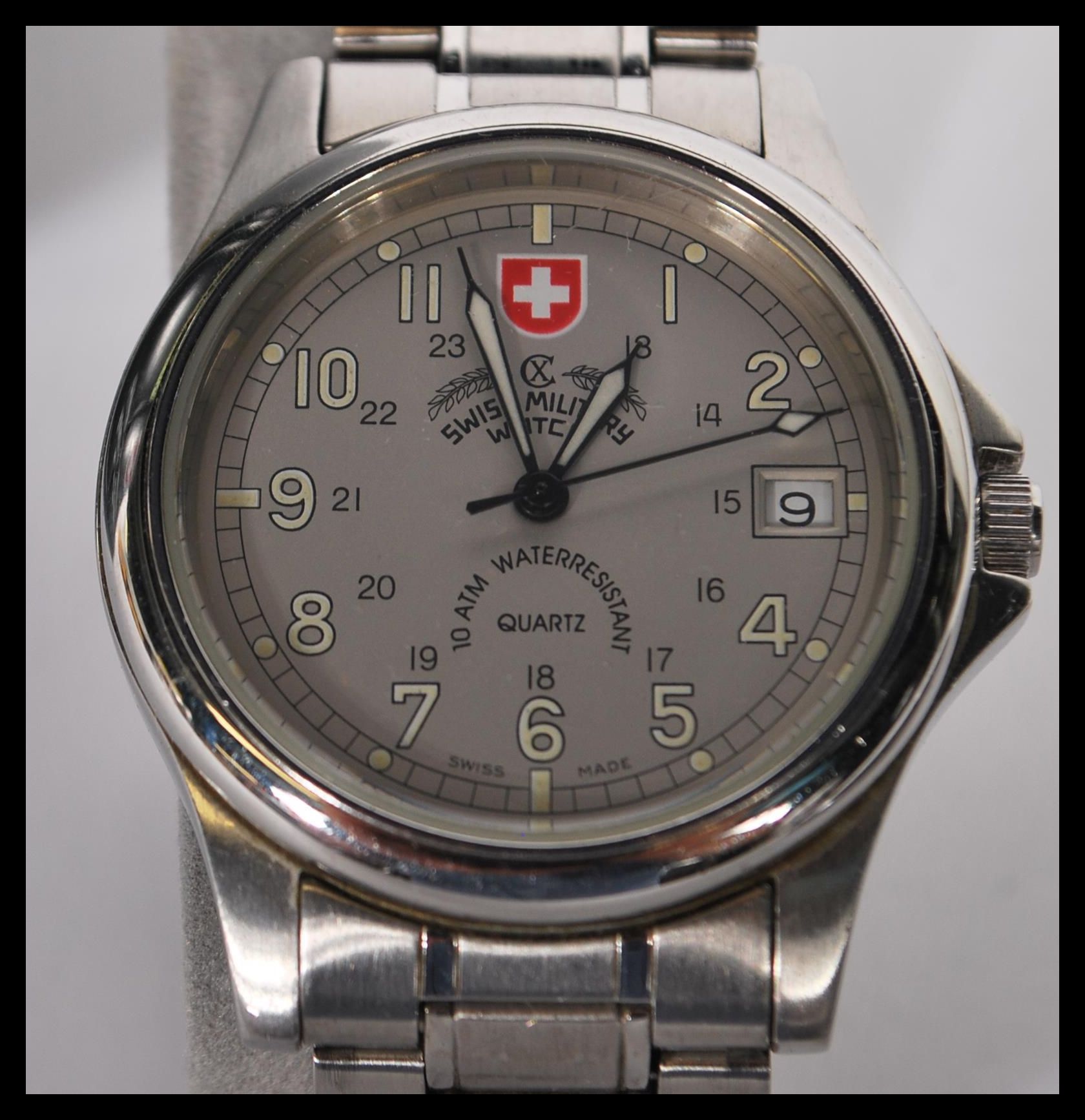 A cased Swiss Military wristwatch by Charmex of Switzerland. The watch