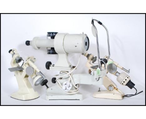 A group of three vintage 20th Century scientific optical instrument to include a Spanish Bobes Keratometer having adjustable 