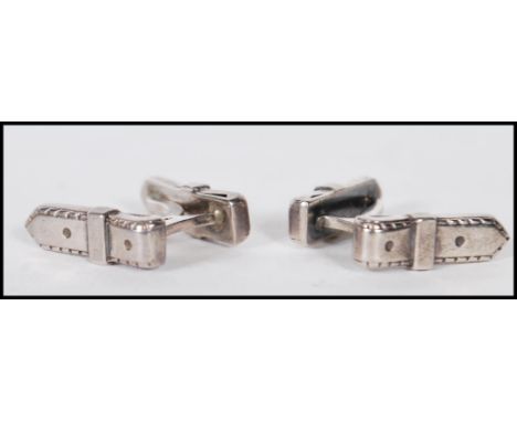 A pair of vintage mid 20th Century Hermes silver cufflinks in the form of belt loops. Marked Hermes. Weight 8.6g. Belt loops 