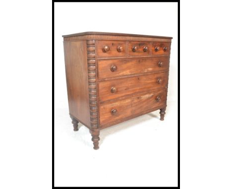 A 19th Century mahogany three over three chest of drawers, three drawers to the top each fitted with a pair of turned handles