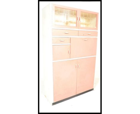 A vintage mid 20th Century two tone kitchen cupboard with applied makers badge for Whiteleaf Modern Furniture. The pink and w