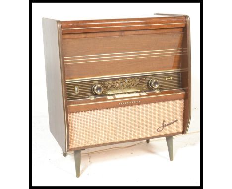 A mid 20th Century record player / stereo gram by Telefunken Fonata 2183, having hinged top opening to revealing the record d