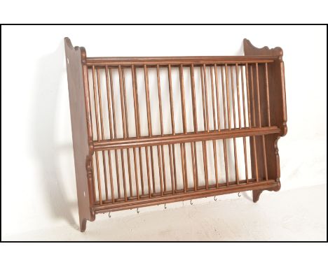 A 20th Century antique style country pine two tier slatted wall hanging plate rack. The plate rack having to two stepped sect