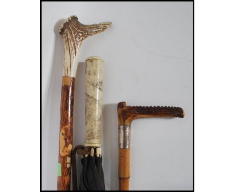 A collection of vintage sticks to include a 19th Century Victorian silver hallmarked collared horn handled riding crop with b