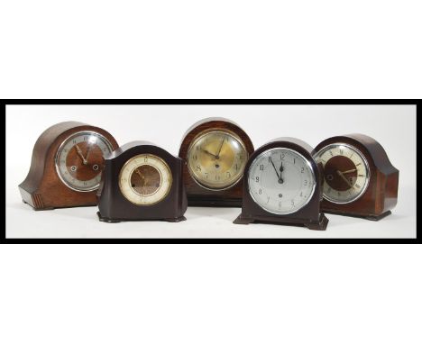 A group of five vintage early 20th Century mantel clocks to include three oak cased examples and two Smiths bakelite examples
